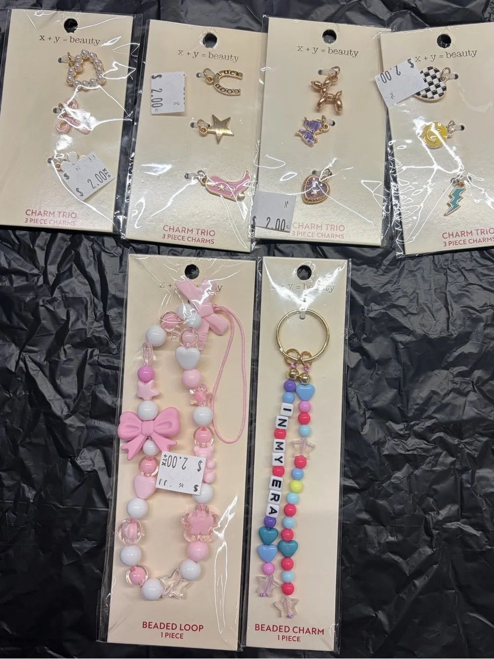 Charm and cellphone wristlet lot 100 packs new sealed packs